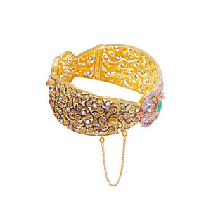  21K gold kara with emeralds and smokey quartz