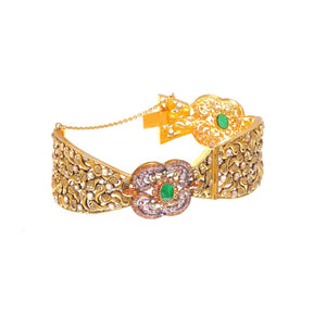  21K gold kara with emeralds and smokey quartz