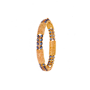 Bejeweled Kara studded with Shappire and Smokey Quartz made in 22k gold and sold as a pair.