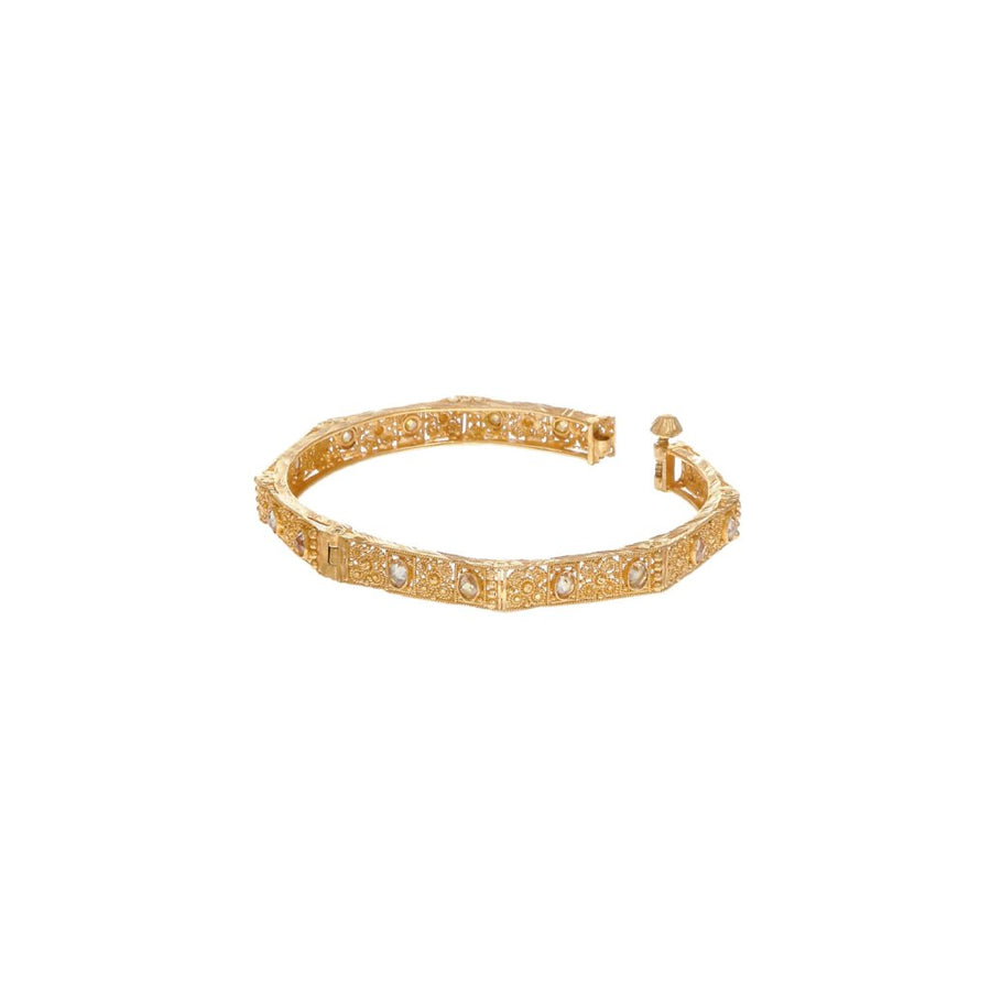 Dainty Kara with matte gold finish and studded with cubic zirconia made in 22k gold