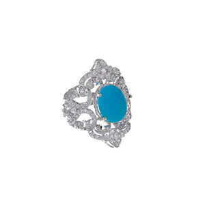 Handmade 22k gold Cubic Zirconia ring with an Turquoise center stone finished in Rhodium